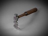 a close up of a hammer with a wooden handle on a white surface