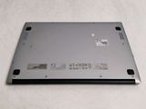 a close up of a laptop on a white surface