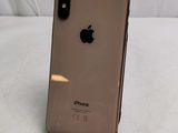 an apple iphone is sitting on a stand on a white surface
