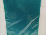 a picture of a blue plastic bag on a white surface