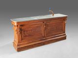 an antique wooden bar with marble top and wooden base