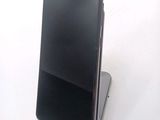 a cell phone that is sitting on top of a stand