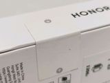 the back of a white box with a black and white logo on it