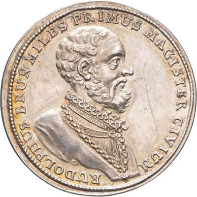 Gros plan sur une pièce d'argent portant le visage d'un homme