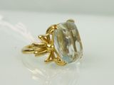 an image of a ring with a blue topazt stone in it