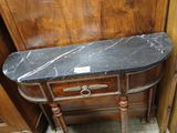 a marble top table with a drawer underneath it