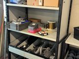 a shelf with a lot of tools on it in a room