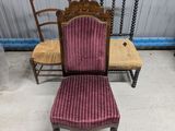 two chairs and a table in a room with a wall in the background