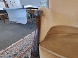 a chair that is sitting in the middle of a room