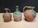 three vases sitting next to each other on a table
