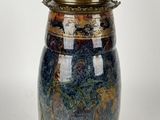 an image of a vase with a lid on a white background
