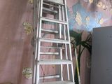 a ladder that is leaning against a wall in a room