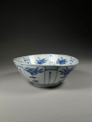 blue and white porcelain bowl with birds and flowers on it