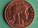 a close up of a coin on a green surface