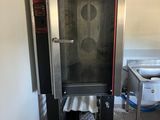 a commercial oven that is sitting in a kitchen
