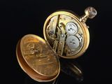 pocket watch on a black background with reflection