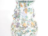 a white vase with a colorful design on it