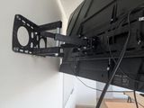 a tv that is mounted on the wall in the room