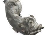 a statue of a fish that is sitting on the ground