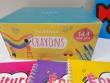 three children ' s crayons books and a box of crayons on a table