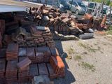 a pile of bricks sitting on the side of the road