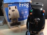 a black coffee maker sitting on a table next to a box