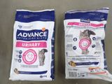 two bags of cat food sitting on top of a table
