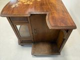 a wooden desk with a mirror on top of it