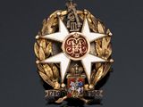 an image of a badge with a star on it on a black surface