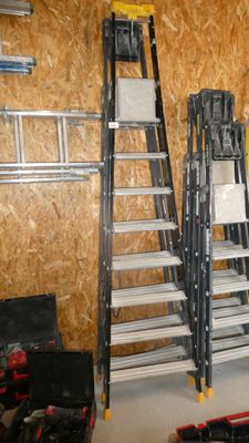 a ladder that is leaning against a wall in a garage
