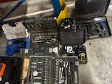 a lot of tools that are laying out on the floor