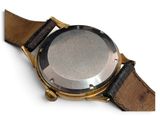 an image of a close up of a watch on a white surface