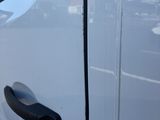 a close up of a white truck with a black door handle