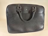 leather laptop case with two handles and a zipper closure