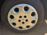 a close up of a flat tire on a truck