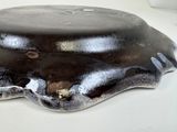 a chocolate cake on a plate on a white table