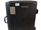 a black suitcase that is sitting on a white surface