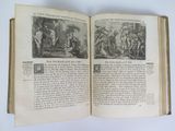 an open book with a picture of a group of people on it