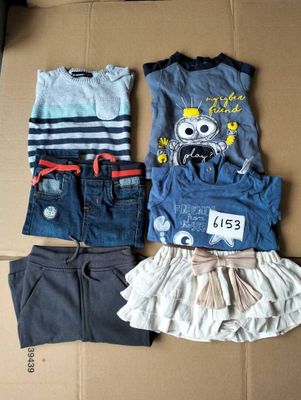 three pieces of clothing are sitting on top of a cardboard box