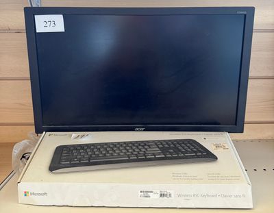 an image of a computer monitor and keyboard sitting on top of a box
