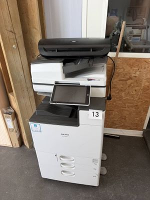 a white printer sitting on top of a black and white printer
