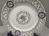 a plate with a floral design on it on a table