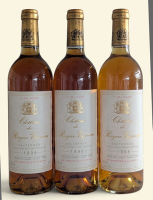 three bottles of wine sitting next to each other on a table
