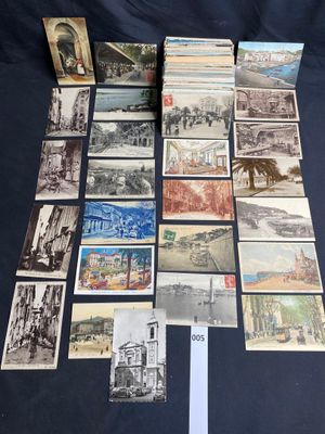 an assortment of old postcards and postcards on a table