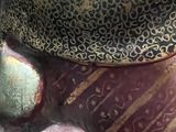 a close up of a statue of a person with a hat on
