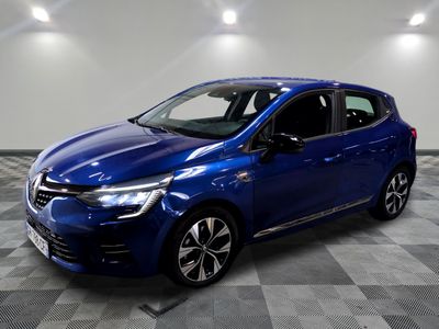 a blue car parked in a garage with a checkered floor