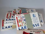 a pile of cards and a pair of red shoes on a table