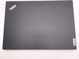 a laptop that is sitting on a white surface