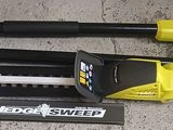 two vacuums and a hose on the floor