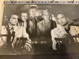 an old black and white photo of a group of men holding guns
